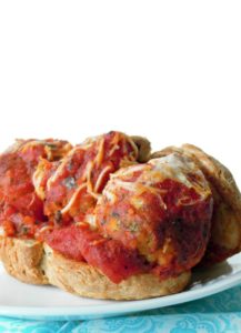 Ground up tempeh, rolled into balls and smothered with marinara sauce make these Vegan Meatball Sub Sandwiches a delicious dinner option!
