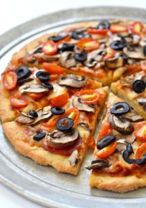 This recipe for a gluten free vegan pizza dough makes for the perfect thin crust canvas for your favorite toppings!