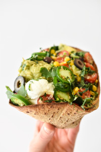 Superfood Baked Taco Salads with tons of good-for-you ingredients surrounded by a baked FlatOut wraps