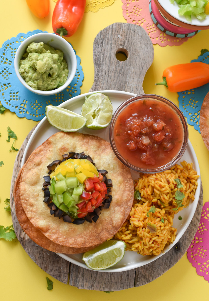 Turn basic corn tortillas into the most festive Cinco de Mayo easy Tostada Sombreros. Dinner is now a fun, holiday-inspired meal!