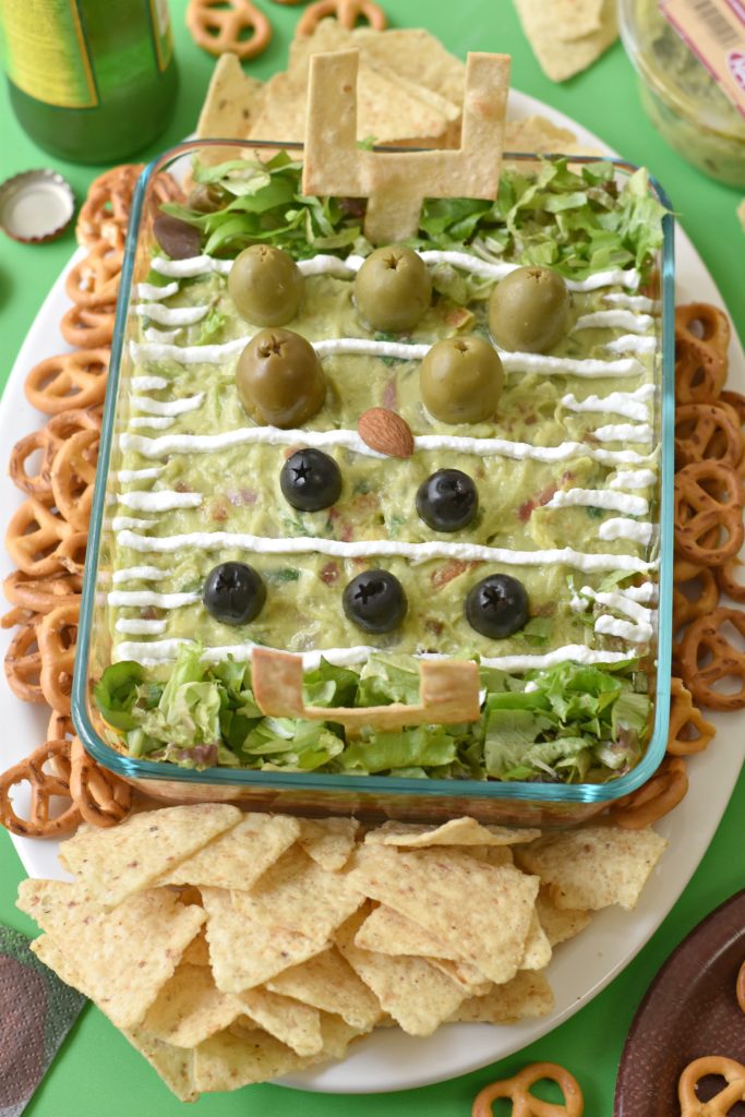 Make the crowd at your house go wild over an edible football field made of beans, cheese, and salsa with this Football Super Dip!