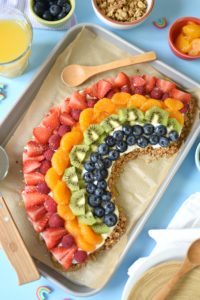 Feel good about feeding your kids a healthy morning meal option when you make them this rainbow-themed No Bake Granola Breakfast Pizza.