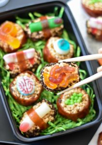 Gross out your family and friend with these creepy Halloween Candy Sushi--the sweet and disgusting version of your favorite takeout!