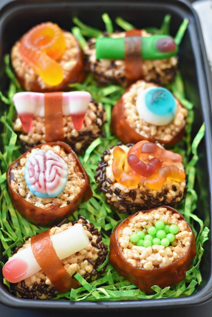 Gross out your family and friend with these creepy Halloween Candy Sushi--the sweet and disgusting version of your favorite takeout! 