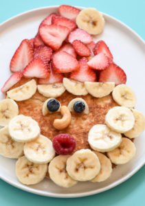 Breakfast is served using Simple Mills' pancake mix, these grain free Healthy Santa Pancakes are the best way to spread holiday cheer #christmasbreakfast #kidfood #funfoodforkids