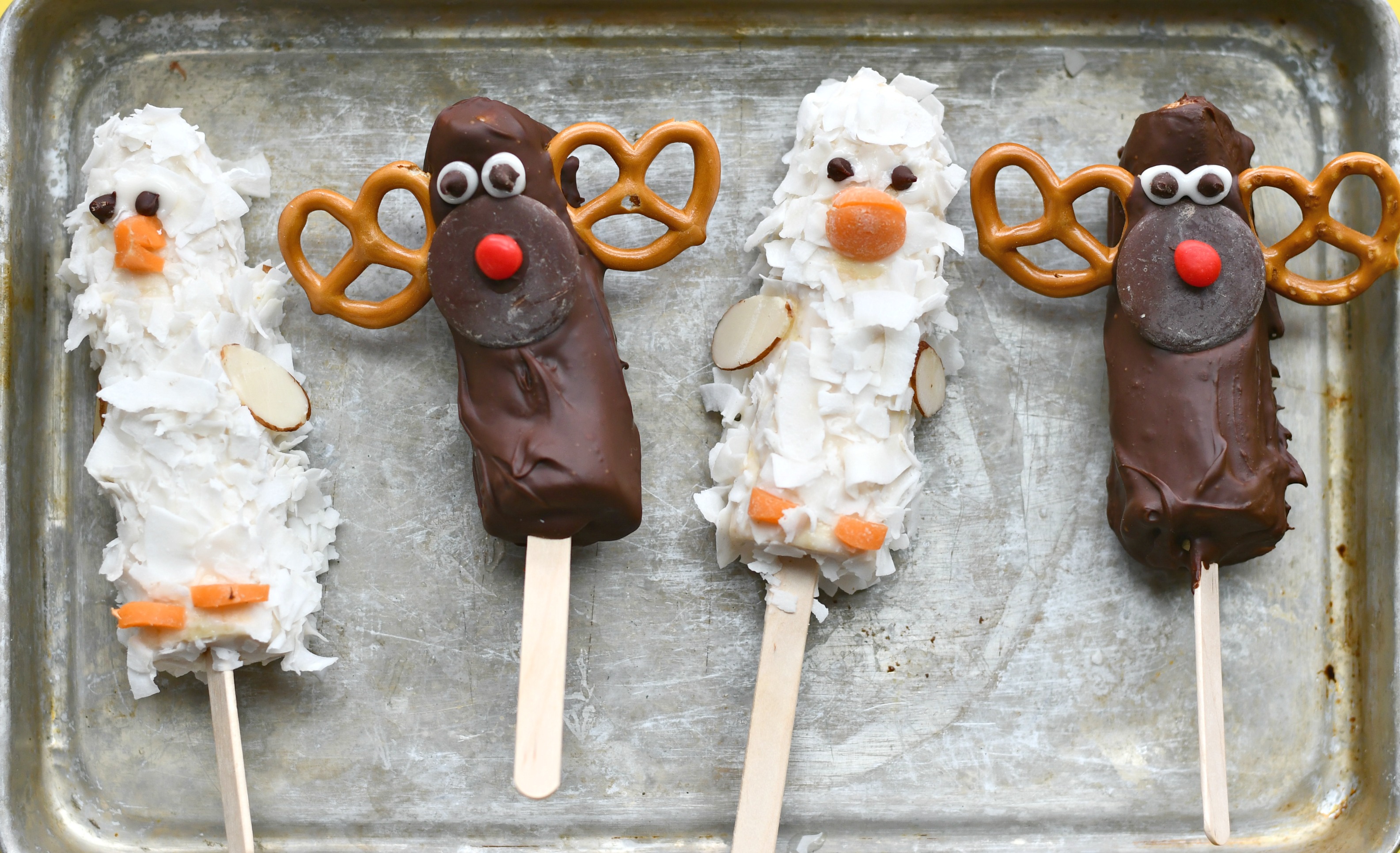 A tray of 4 banana pops: 2 banana yogurt goose pops and 2 moose banana pops