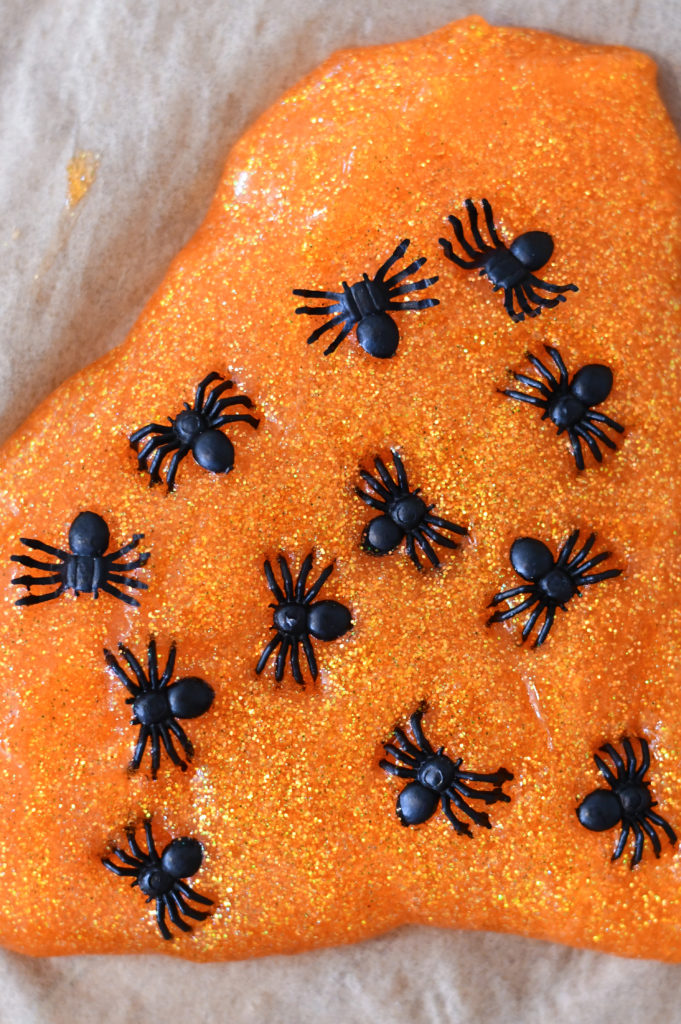 a pile of orange halloween slime with fake ants