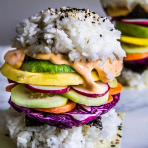 Get your kids involved with piling on the veggies on these Rainbow Sushi Burgers for a perfect meatless meal that all can participate in making & will love! #veganrecipes #kidfood #sushi #dinner