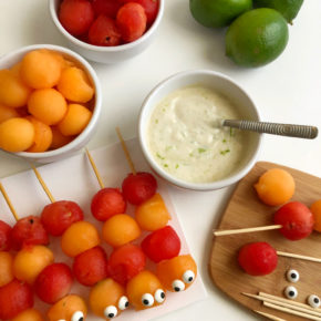 Cute pre-made Caterpillar Fruit Kebabs, ready for dipping